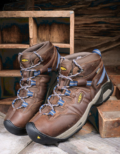 Keen Detroit XT boots resting on a wooden shelf