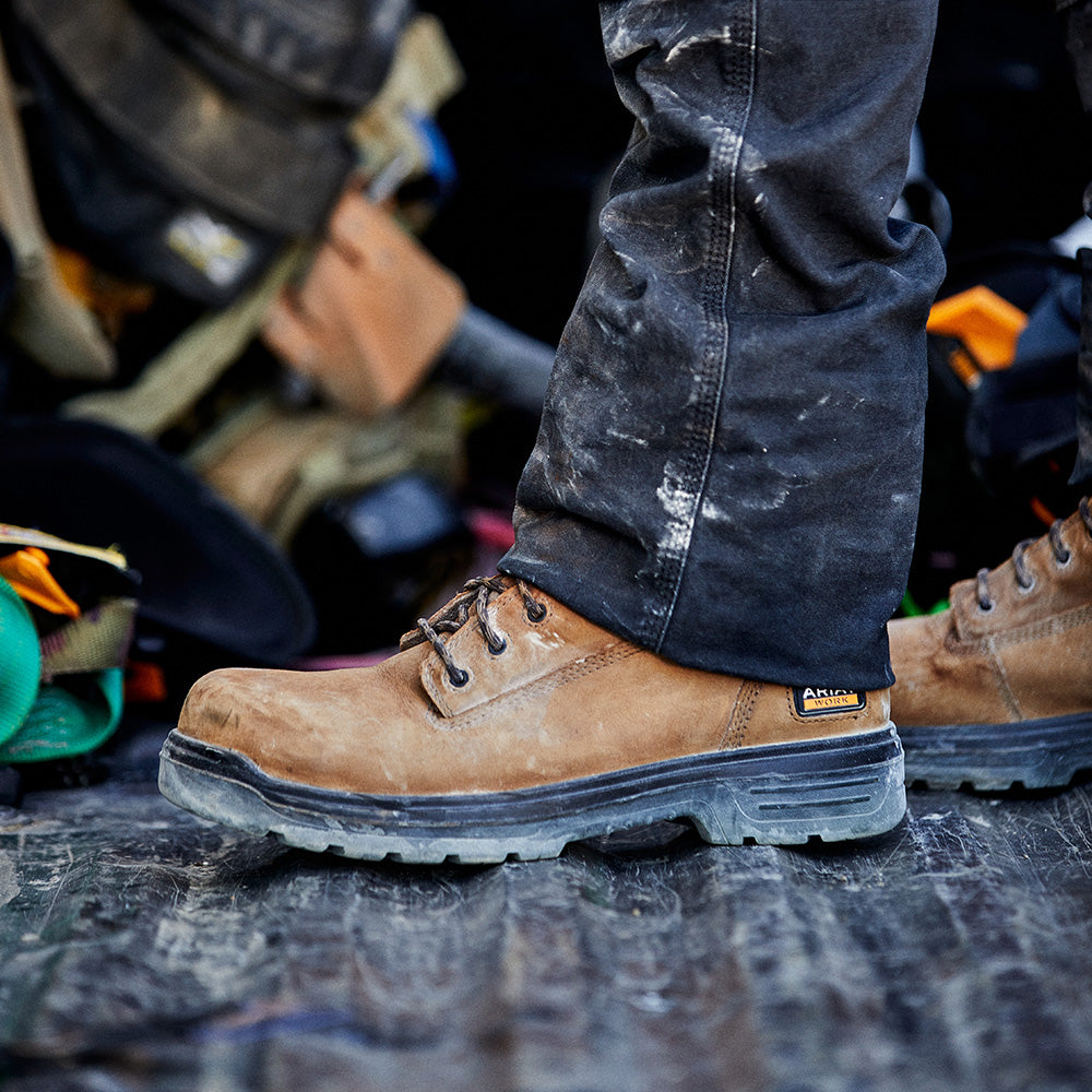 A man at the work site in his safety work boots