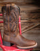 Profile of Ariat cowgirl boot 10044473 on a red chair 