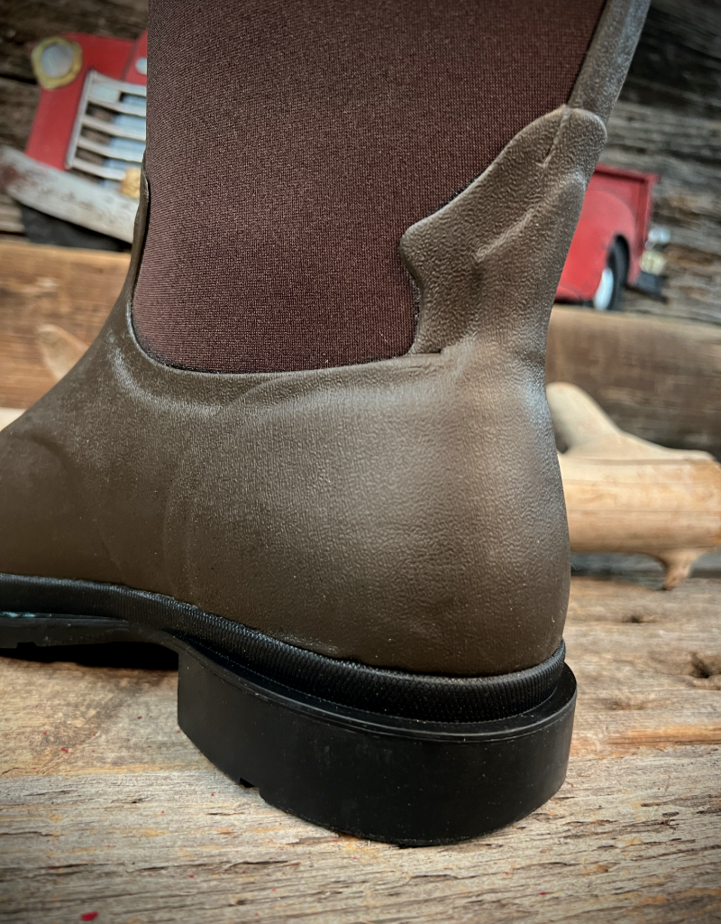 Brown rubber boot on a wooden floor