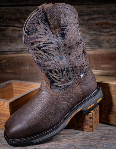 Brown cowboy boot with western design on a wooden background
