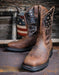A pair of Ariat men's work boots with full-grain leather and a patriotic stars and stripes design on the shaft, featuring a steel toe cap.