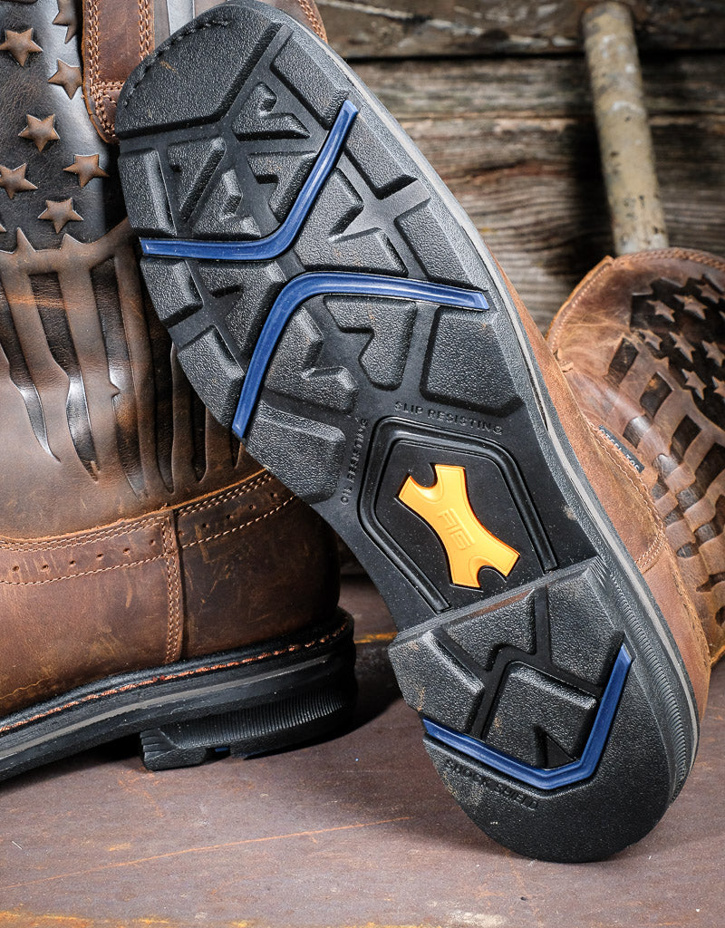 Close up on Ariat black rubber sole that features the words Oil resistant and slip resistant 