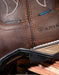 Close-up of a brown leather boot with 'DryShield' and 'Composite Toe' labels.