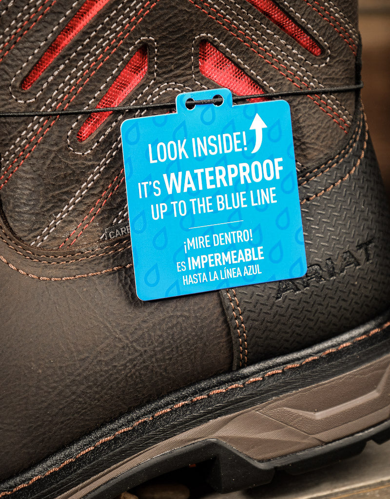 Close-up of a waterproof boot with a blue label indicating water resistance.
