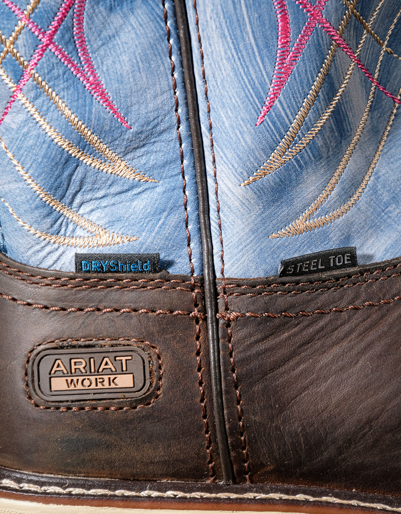 Close-up of Ariat work boots with blue embroidered design,  'Steel Toe' label and DryShield label.