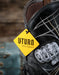 Black boot with a yellow 'U Turn' tag and 'Live' fist patch on a blurred background