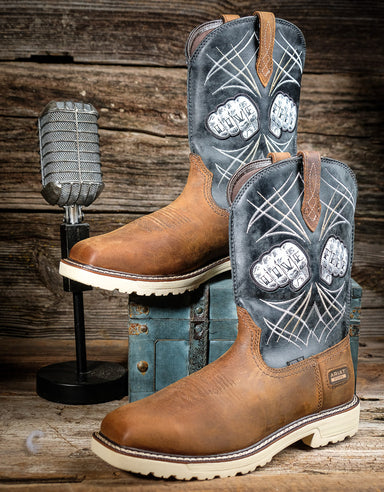 Brown work boots with decorative inlays on a wooden background