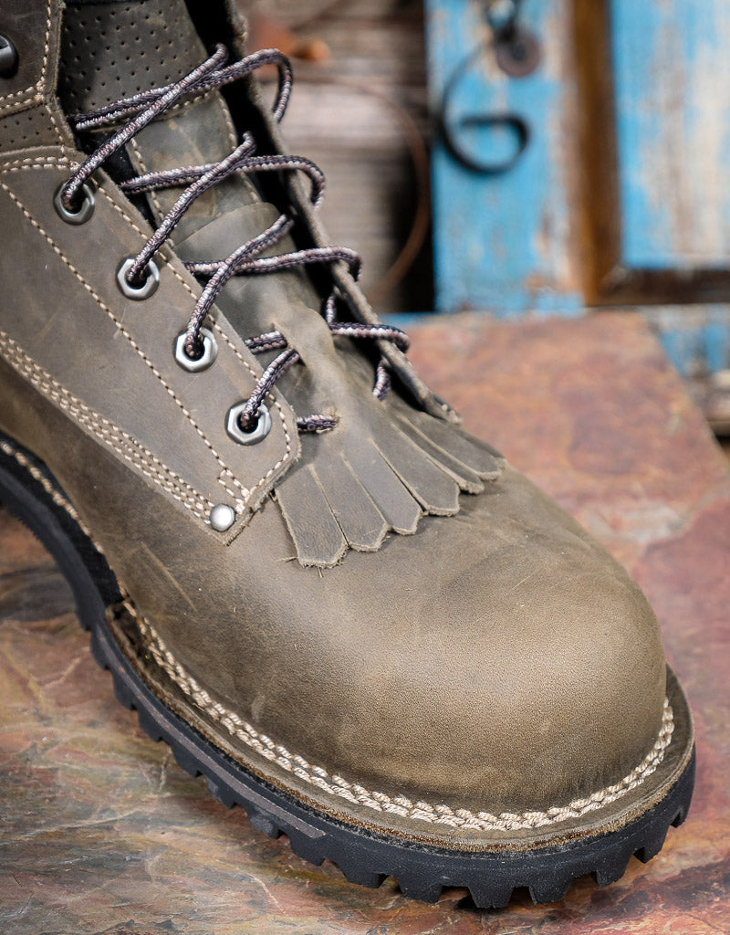 Grey leather boot with laces on a rustic background