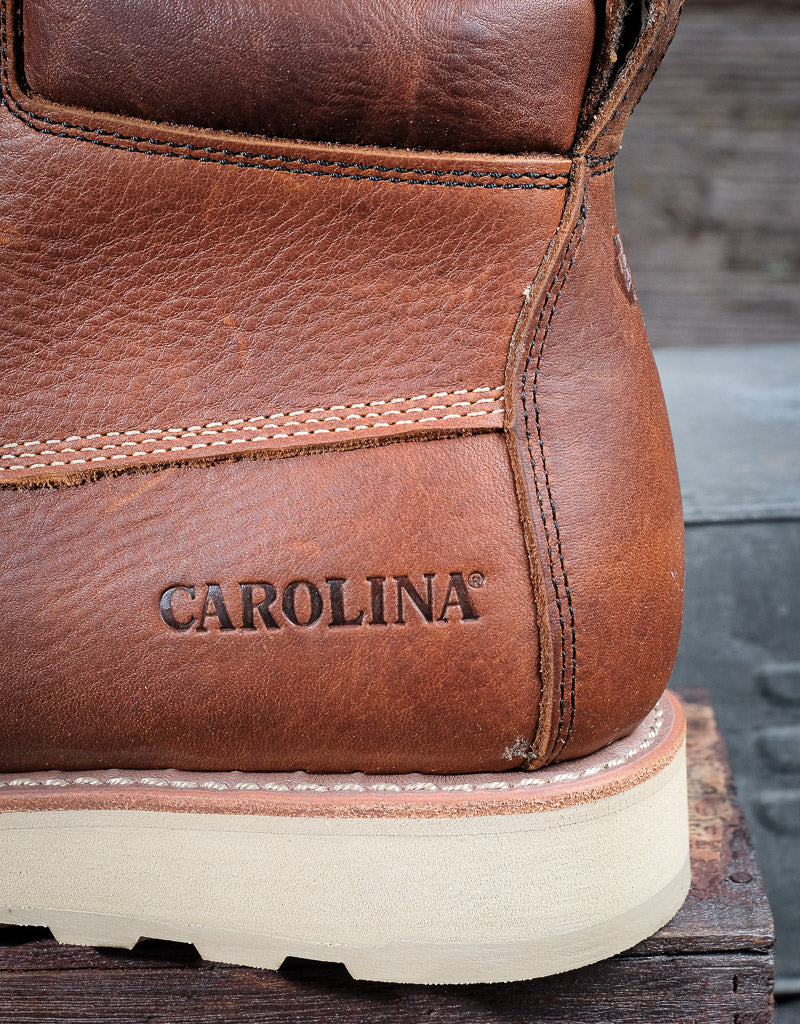 Close up of Carolina insignia stamped on the side of the leather heel