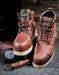 a pair of boots sitting on top of a box with a wooden background