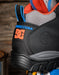 Close-up of a DC Shoes DC USA sneaker in black, gray, orange, and blue, showing the heel, DC logo, and pull tabs.