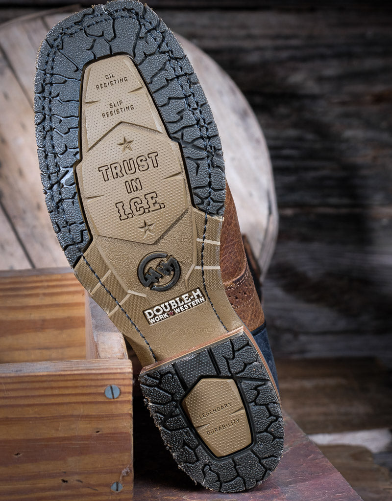 Close-up of a shoe sole with 'Trust in L.C.E.' text on a wooden surface.