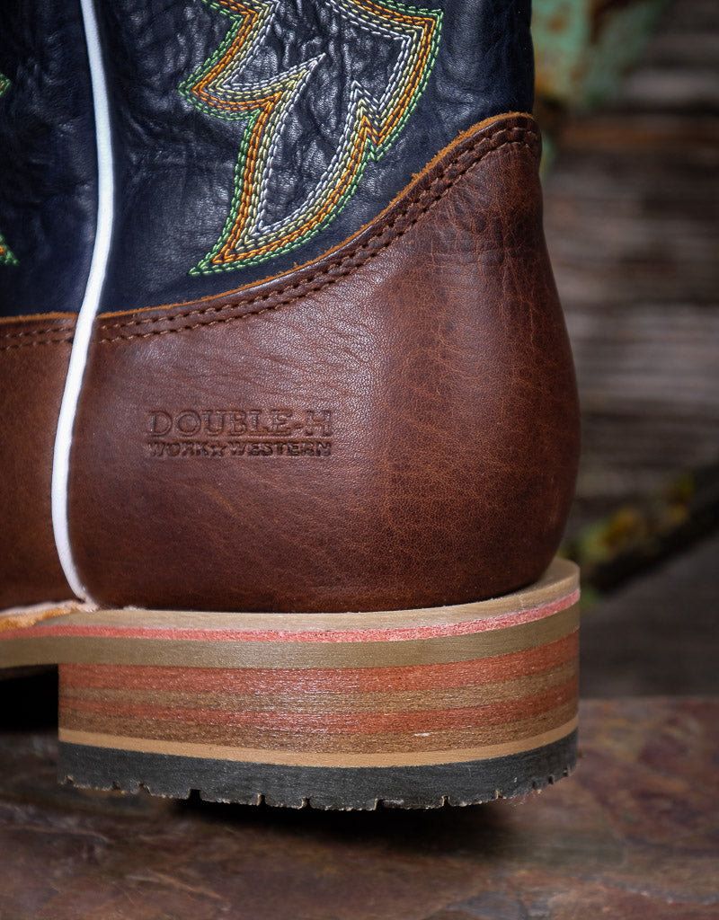 Close-up of a brown leather boot with 'Double H' branding on a rustic background
