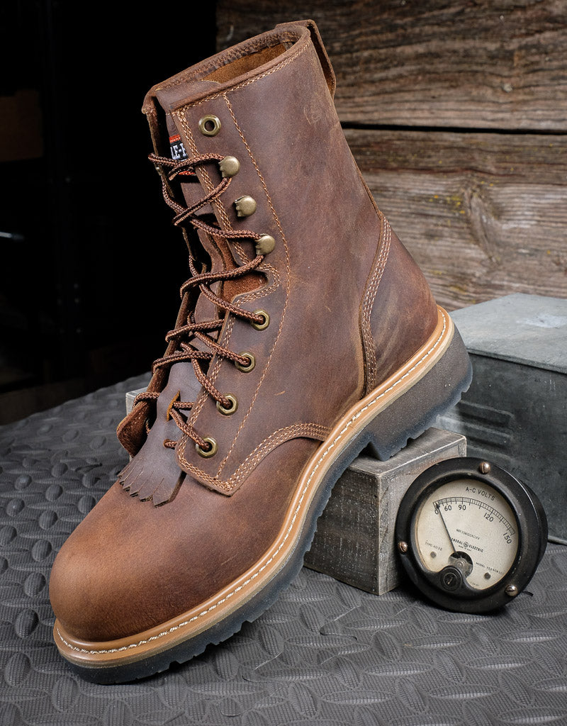 profile of 8" laceup brown boot with the heel propped up on the box