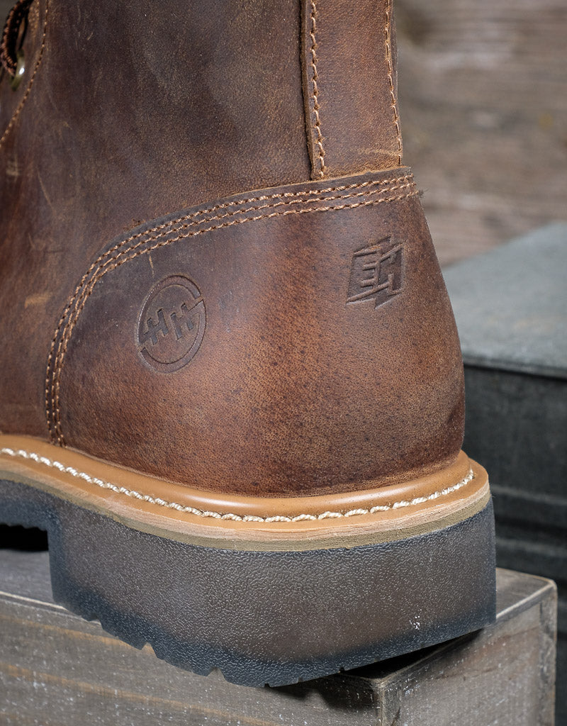 close up on the double h logo and EH logo stamped into the leather on the heel of the boot