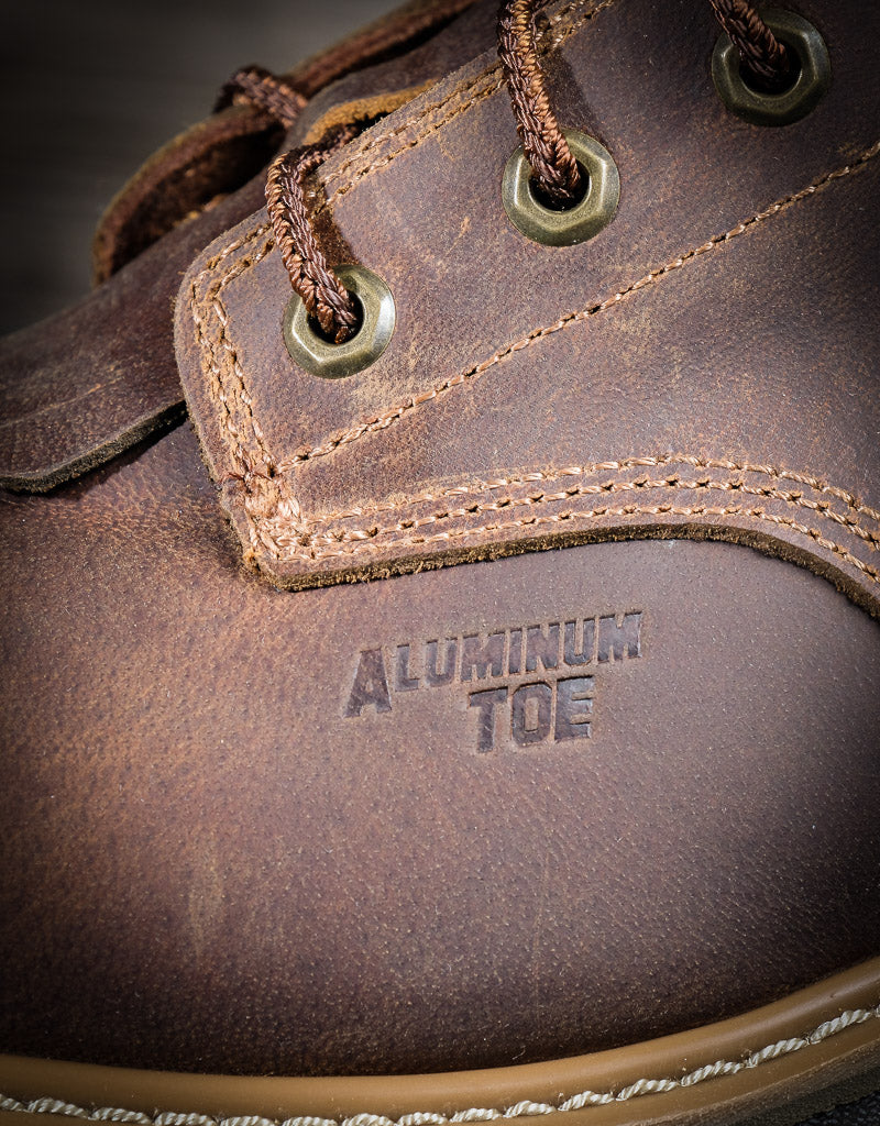 closeup of 'Aluminum toe' stamped into the side of the boot leather