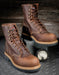 8 inch tall laceup boots sitting on a box with a wooden background