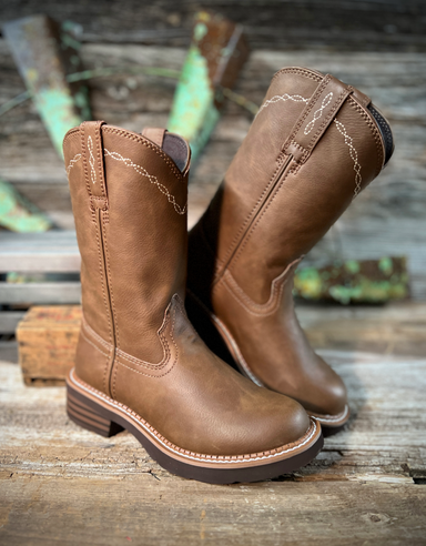 Pair of brown leather boots on a wooden surface