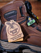 Brown work boot with Georgia Boot tag and label on a wooden surface