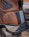 Brown boot with Georgia Boot logo on a wooden surface