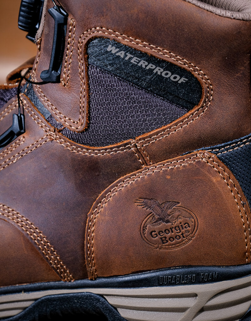 Close-up of a brown leather boot with 'Georgia Boot' logo and waterproof label.
