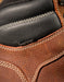 Close-up of brown leather boot with visible stitching and 'Keen Dry' tag