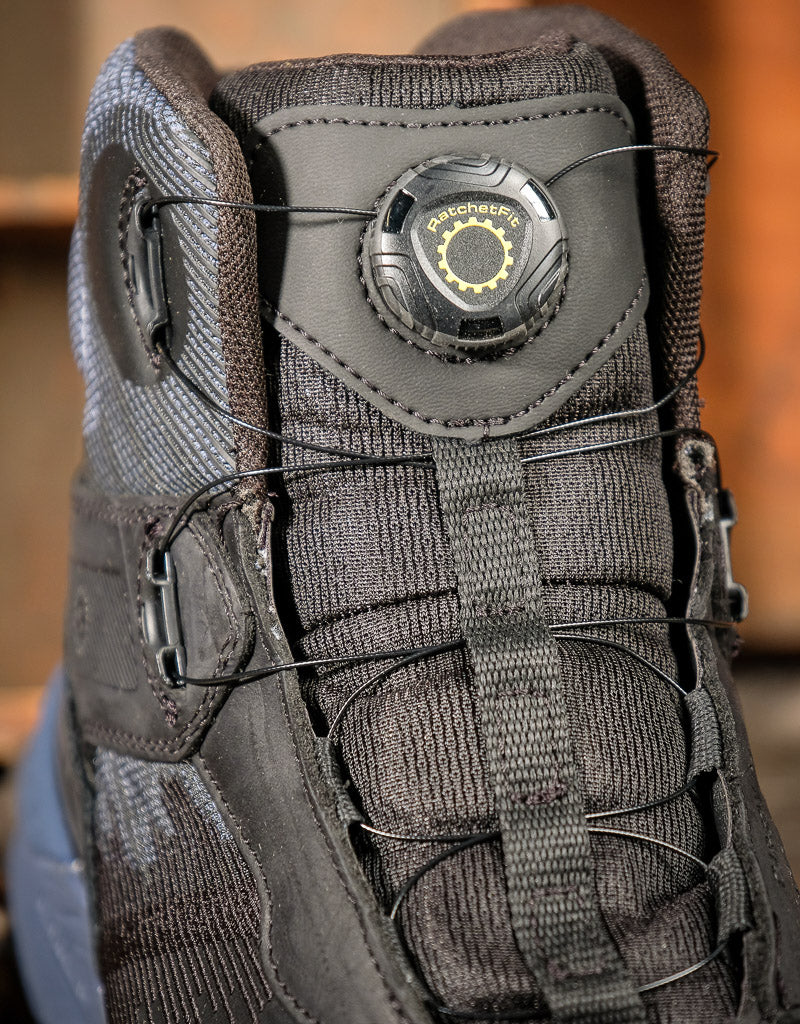 Close-up of a tactical boot with a Keen RatchetFit system on a blurred background