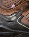 Close-up of a brown and black shoe with a visible American Built logo and American flag patch.