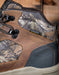 Close-up of a brown and camouflage hiking boot with KeenDry technology label.