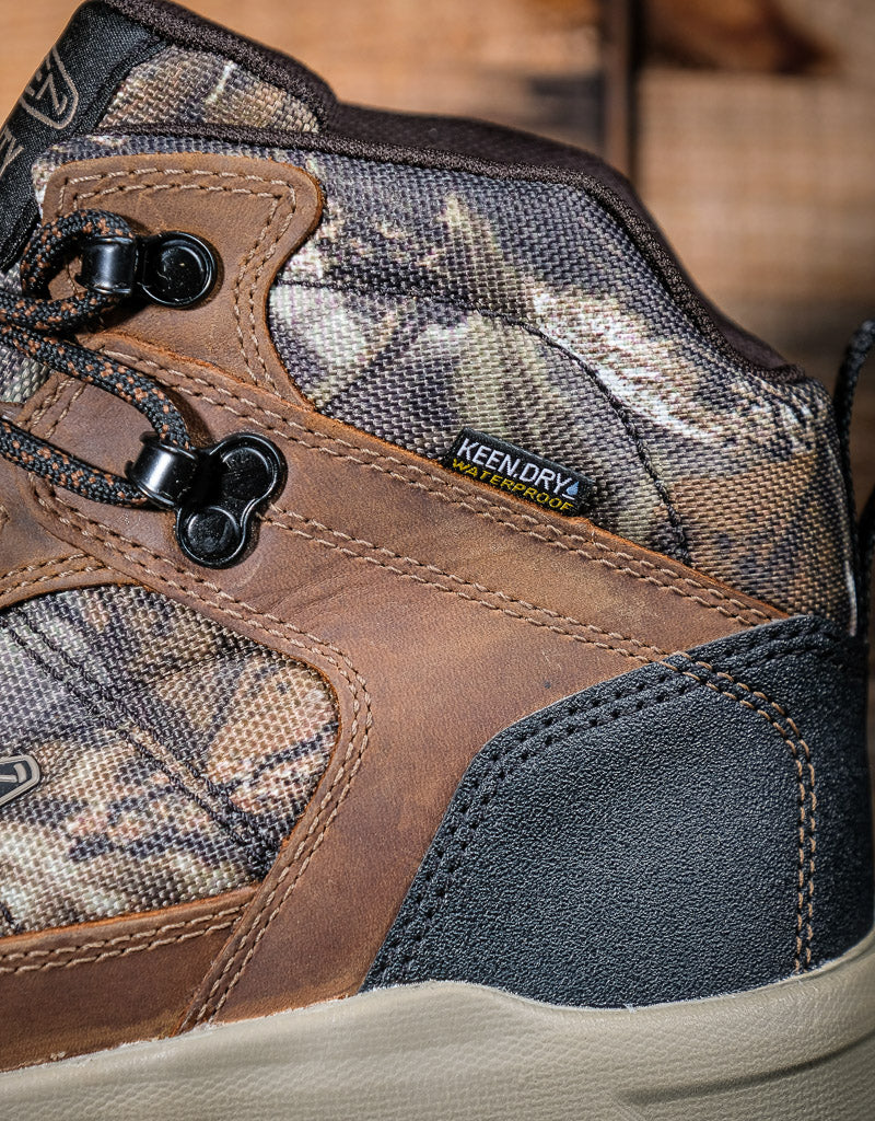 Close-up of a brown and camouflage hiking boot with KeenDry technology label.