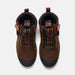 A pair of Timberland Pro hiking boots in brown leather with black and orange accents, shown from a top-down view on a light gray background.