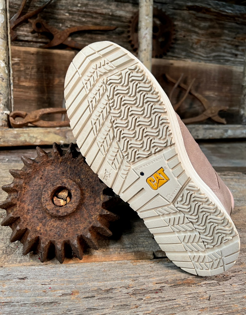 white boot sole with tread pattern on a rustic wooden background