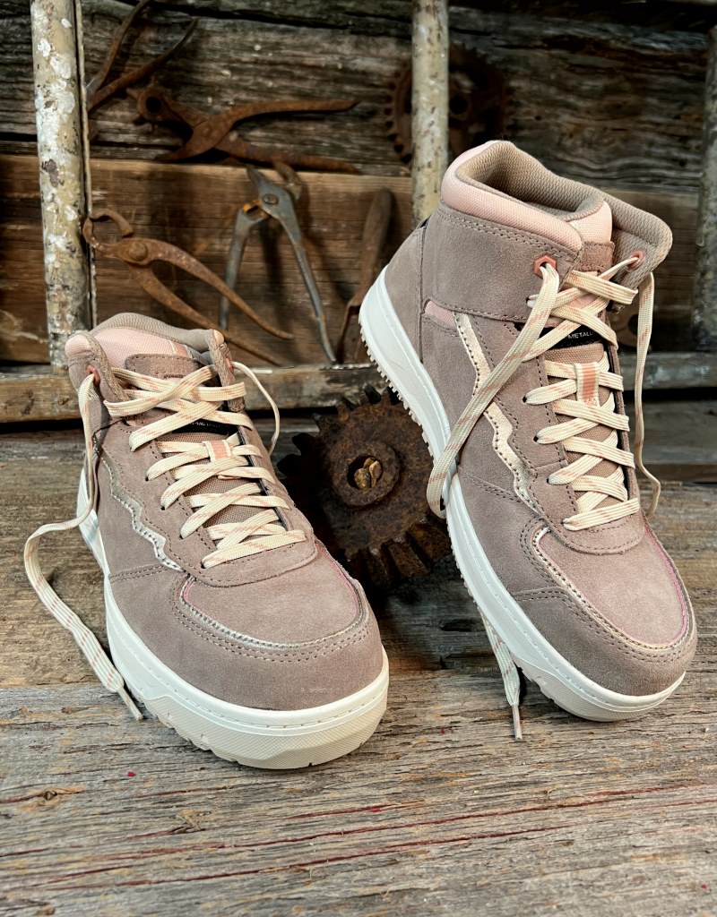Pair of brown high-top sneakers on a rustic wooden background