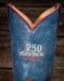 Blue leather boot with '250 America 1776-2024' embroidery on a wooden background