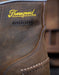 Close-up of a brown leather boot with 'Thorogood' branding and 'Waterproof' label.