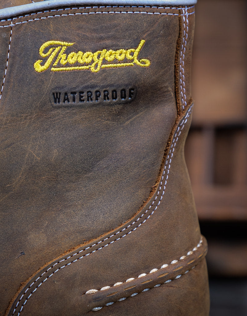 Close-up of a brown leather boot with 'Thorogood' branding and 'Waterproof' label.