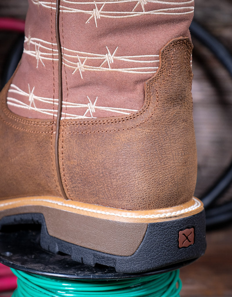 Close-up of a brown boot with barbed wire pattern on a blurred background