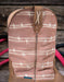 Brown cowboy boot with barbed wire pattern on a wooden background