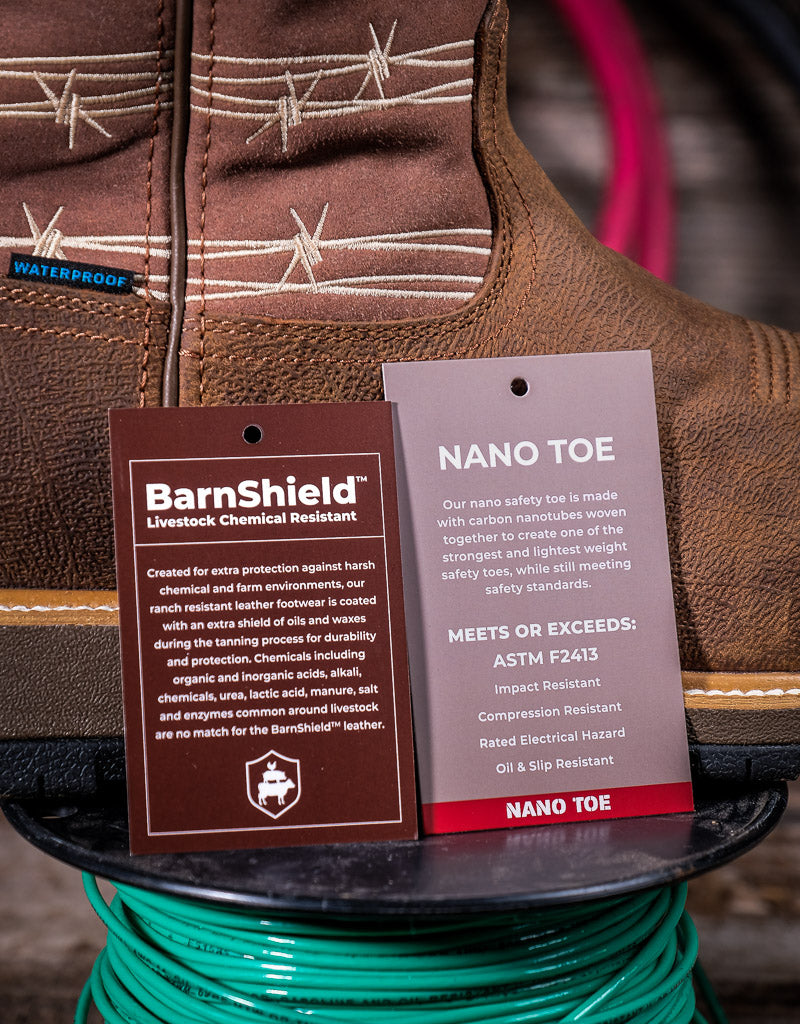Brown leather boot with BarnShield and Nano Toe labels on a blurred background