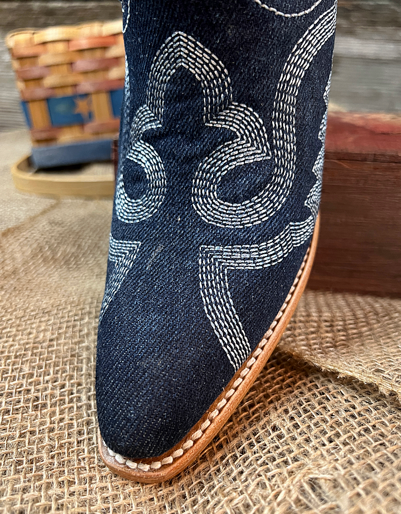 Close up on pointed toe with white western stitching 