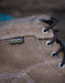Close-up of a brown suede boot with a KEEN DRY WATERPROOF label on a blurred background