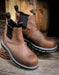Pair of brown leather boots with black elastic sides on a wooden surface