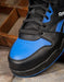 close up on the toe of reebok shoe the top is blue and black