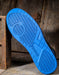 Bottom of reebok shoe showing tread pattern and blue colored sole