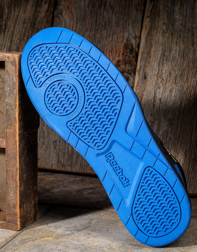 Bottom of reebok shoe showing tread pattern and blue colored sole